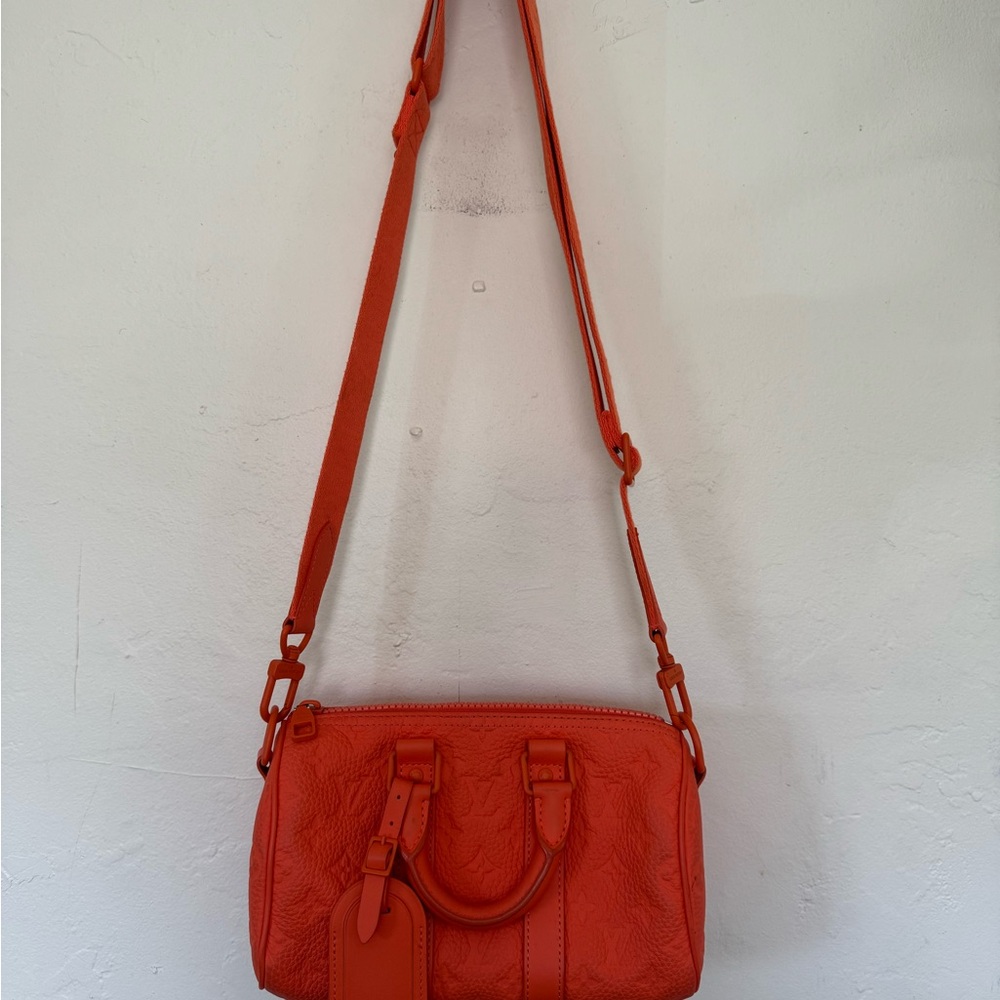 Louis Vuitton Orange Crossbody Bag with Gold Accents